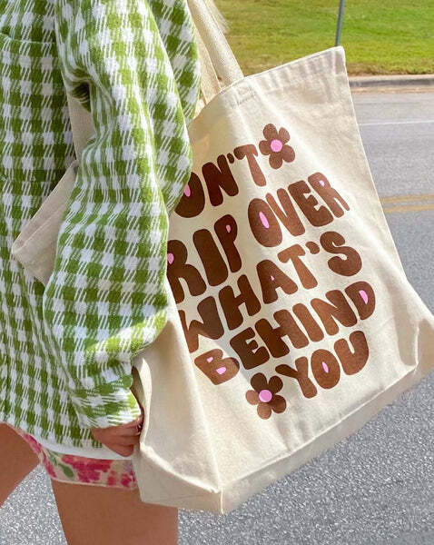 DON'T TRIP OVER WHAT'S BEHIND YOU' LARGE TOTE BAG